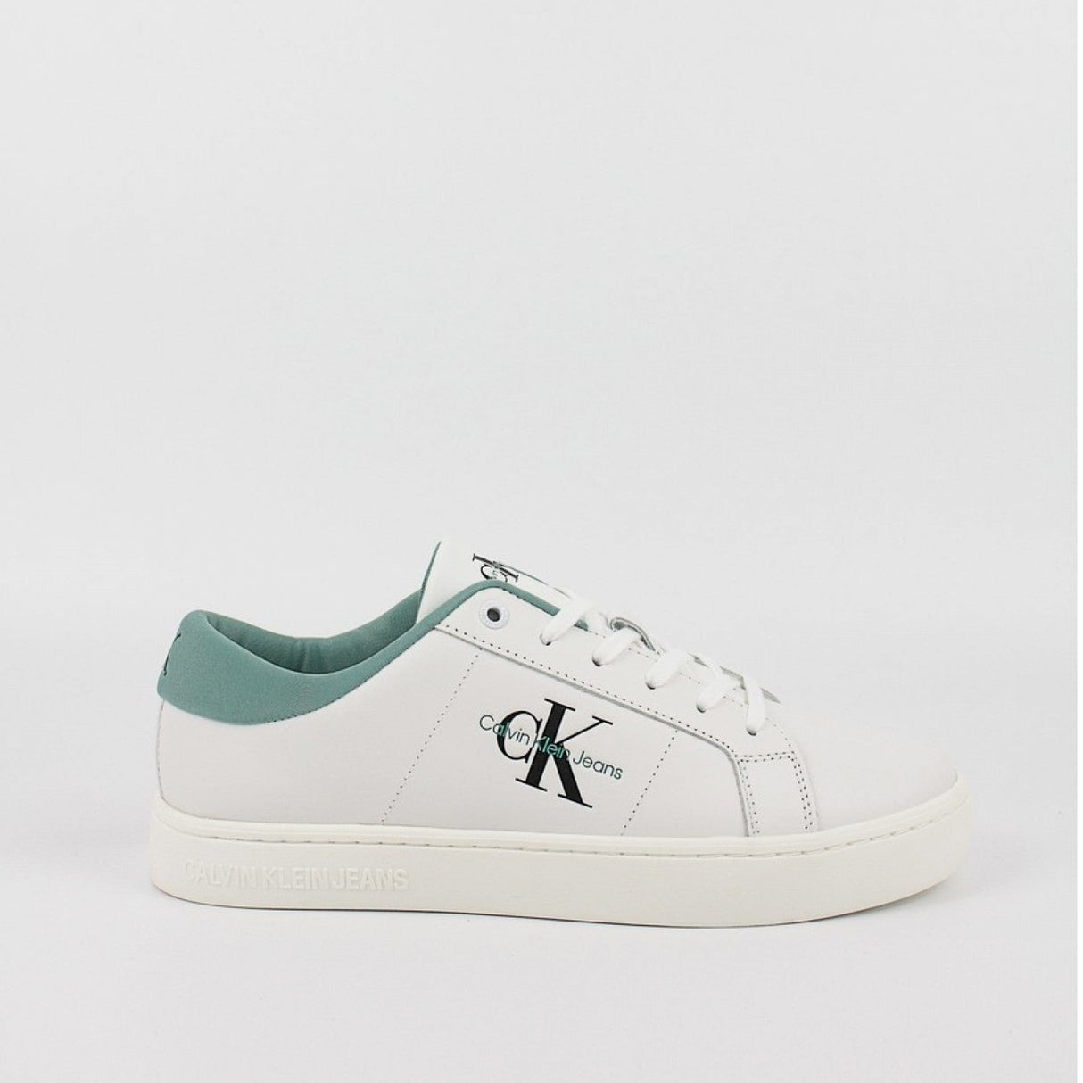 This is a pair of men's Calvin Klein Jeans Classic Cupsole Low Laceup sneakers in bright white leather with a turquoise/oil blue heel tab.