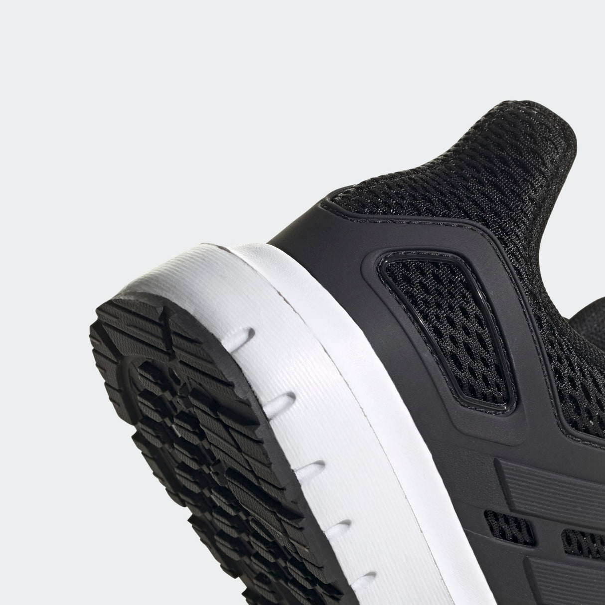 Adidas Ultimashow running shoe in black with a white midsole.