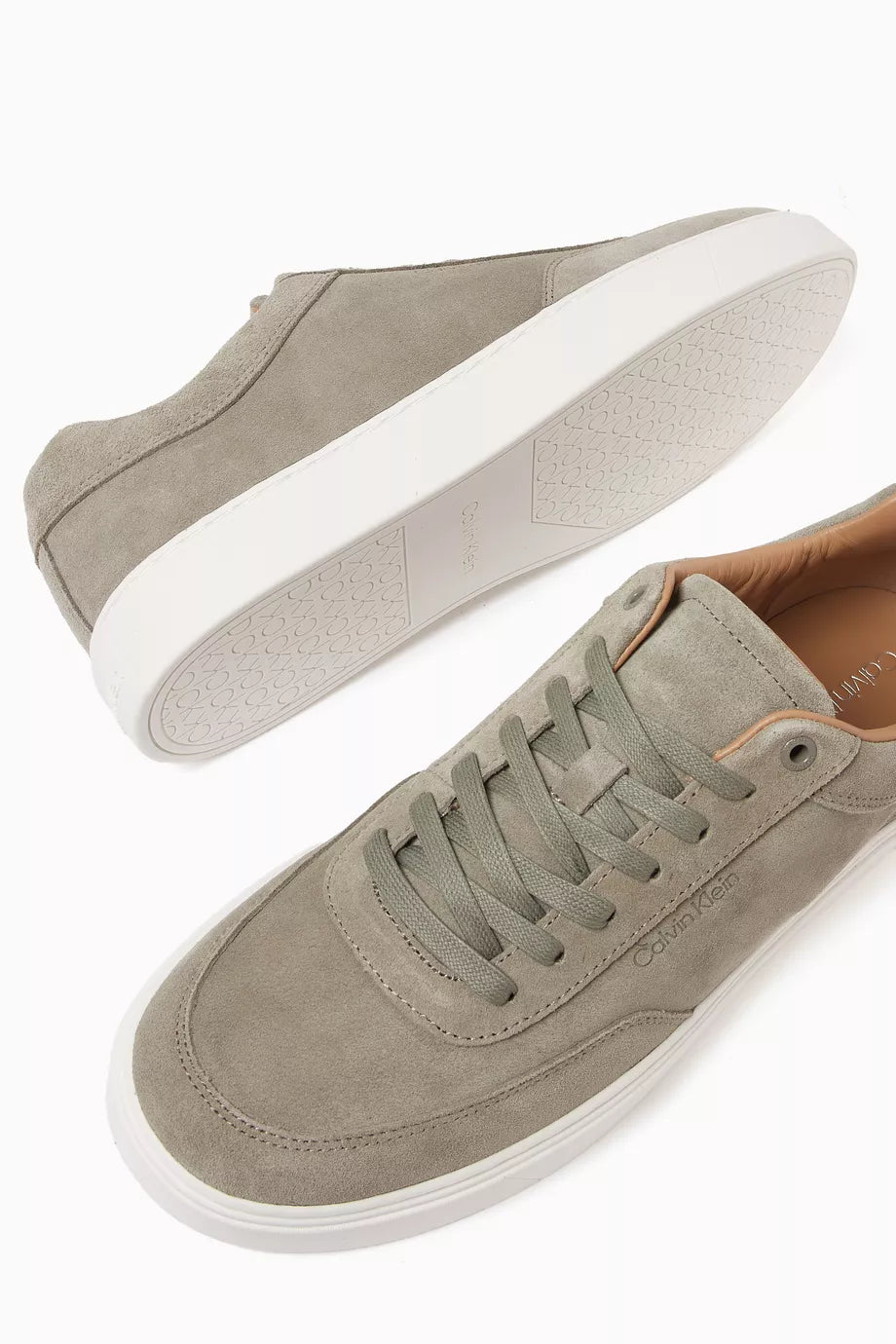 This is a pair of Calvin Klein Clean Cup Low Lace-up Oxf Su sneakers