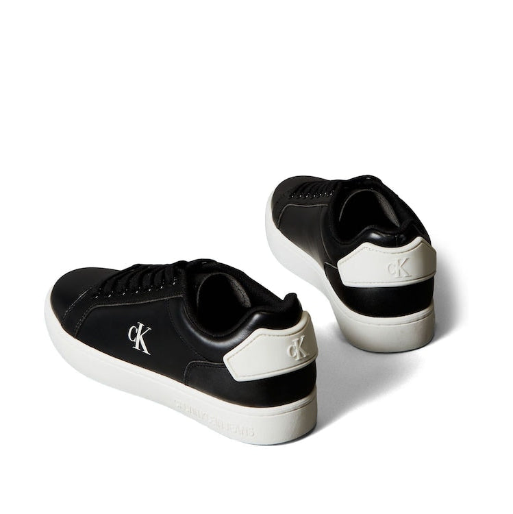 This is a pair of Calvin Klein Classic Cupsole Patch Leather sneakers in black and white.