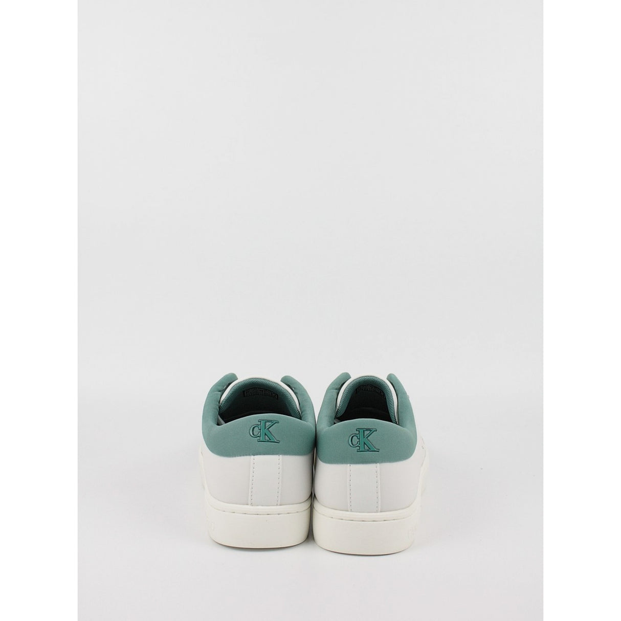 This is a pair of men's Calvin Klein Jeans Classic Cupsole Low Laceup sneakers in bright white leather with a turquoise/oil blue heel tab.