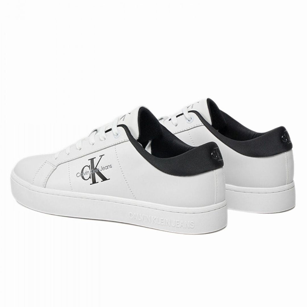 Calvin Klein Jeans Classic Cupsole low-top leather sneakers in white and black.