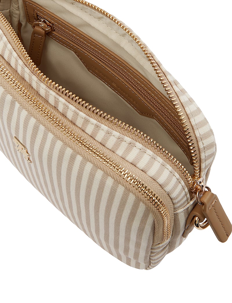 Tommy Hilfiger Poppy Summer Camera Bag in a striped design with a beige and off-white color scheme.