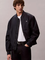 This is a Calvin Klein Nylon Bomber Jacket in navy blue_ Navy