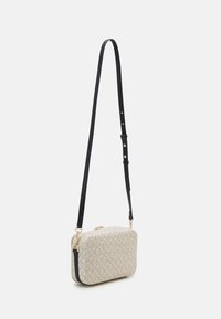 Tommy Hilfiger Women’s Beige & Black Crossbody Bag – Compact Elegance