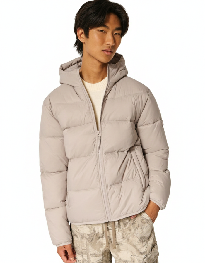 This is a Hollister men's hooded puffer jacket in a beige color.