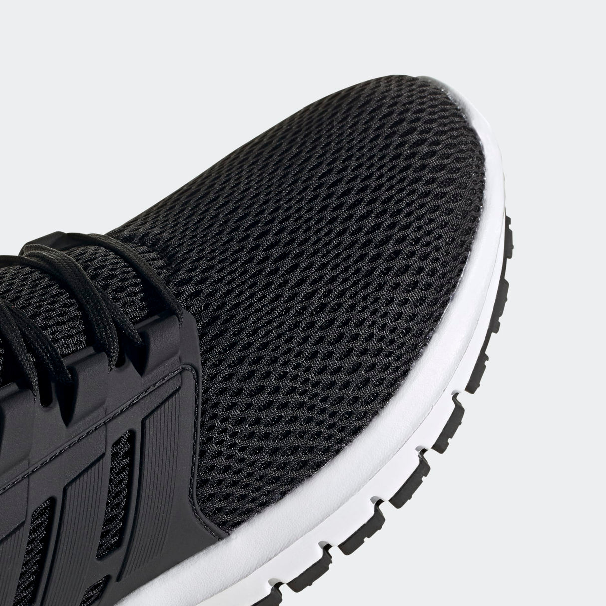 Adidas Ultimashow running shoe in black with a white midsole.