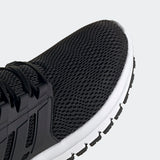 Adidas Ultimashow running shoe in black with a white midsole.