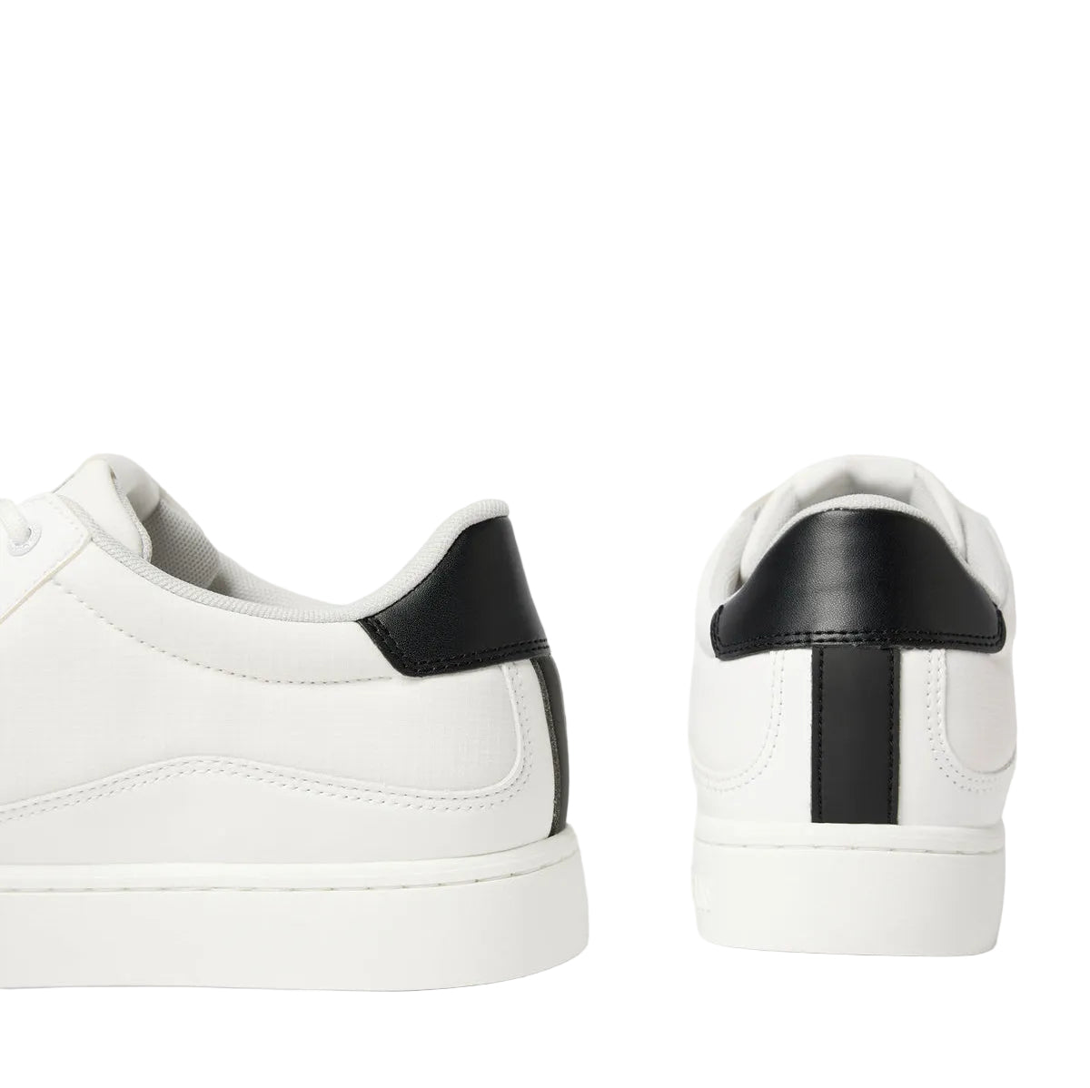 This is a pair of Calvin Klein Jeans Classic Cupsole Tech Ripstop men's sneakers in white with a black heel tab.